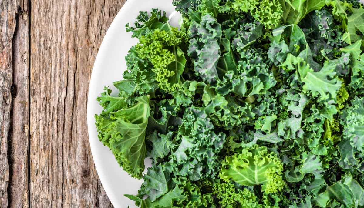 Leafy Kale in a bowl on a wooden table