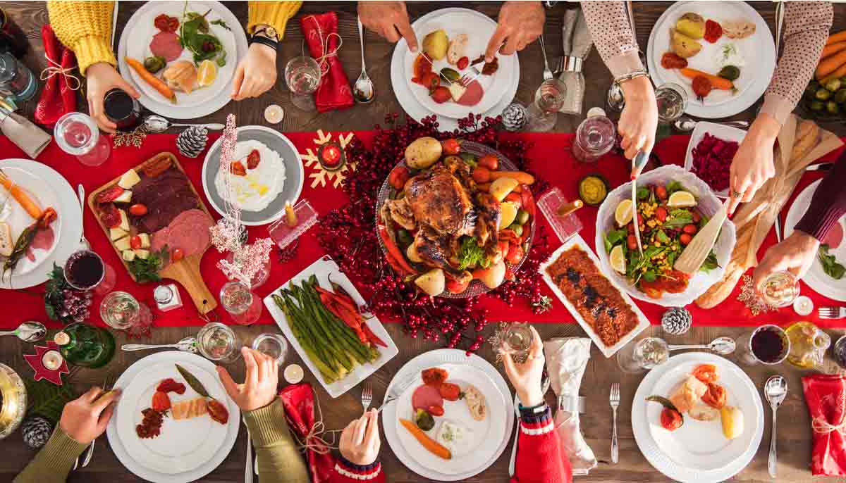 A large Christmas Meal spread out on a dining room table