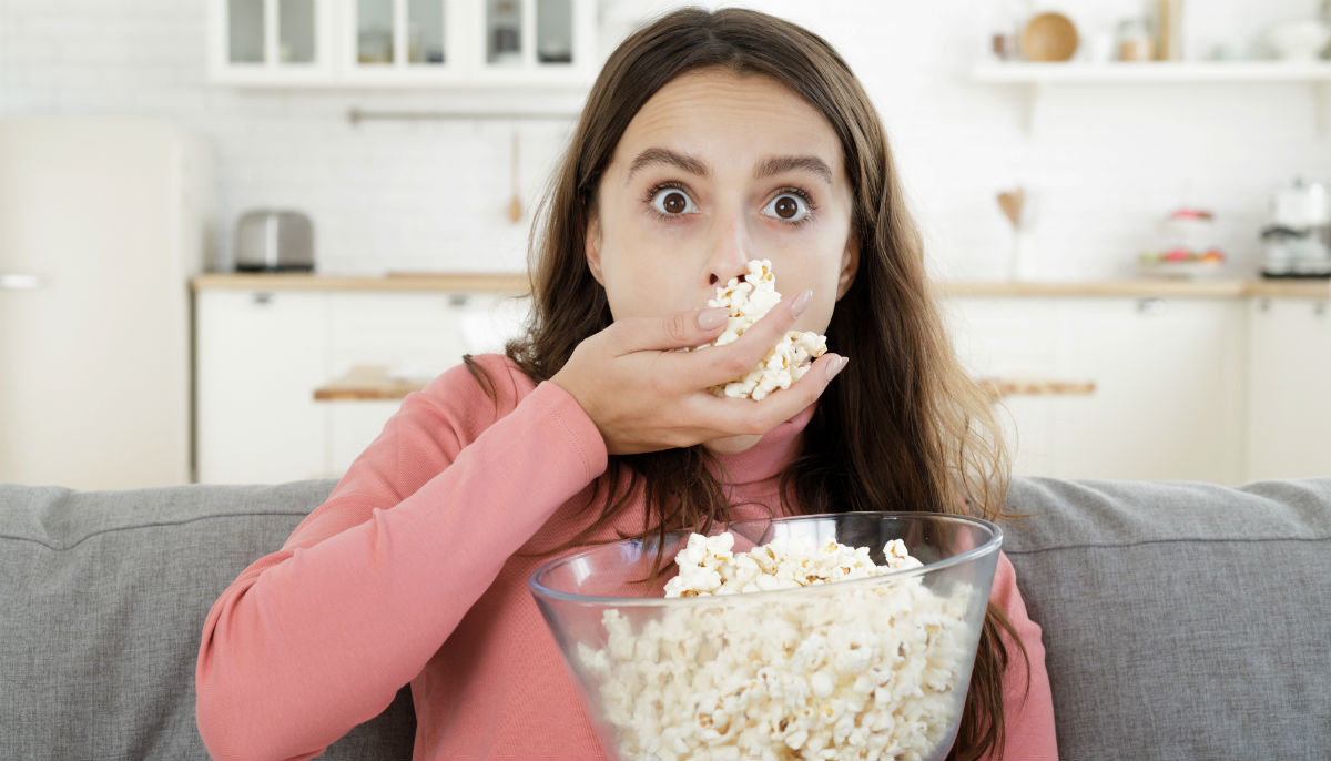 woman eating popcorn