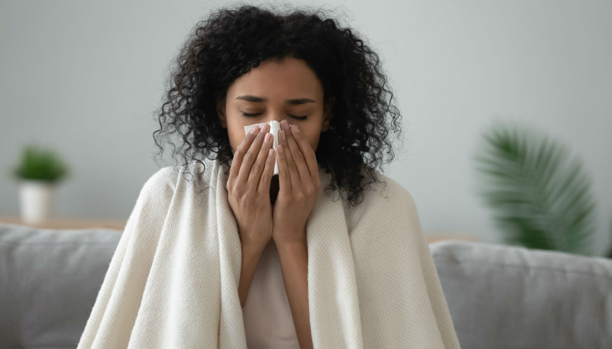 woman sneezing