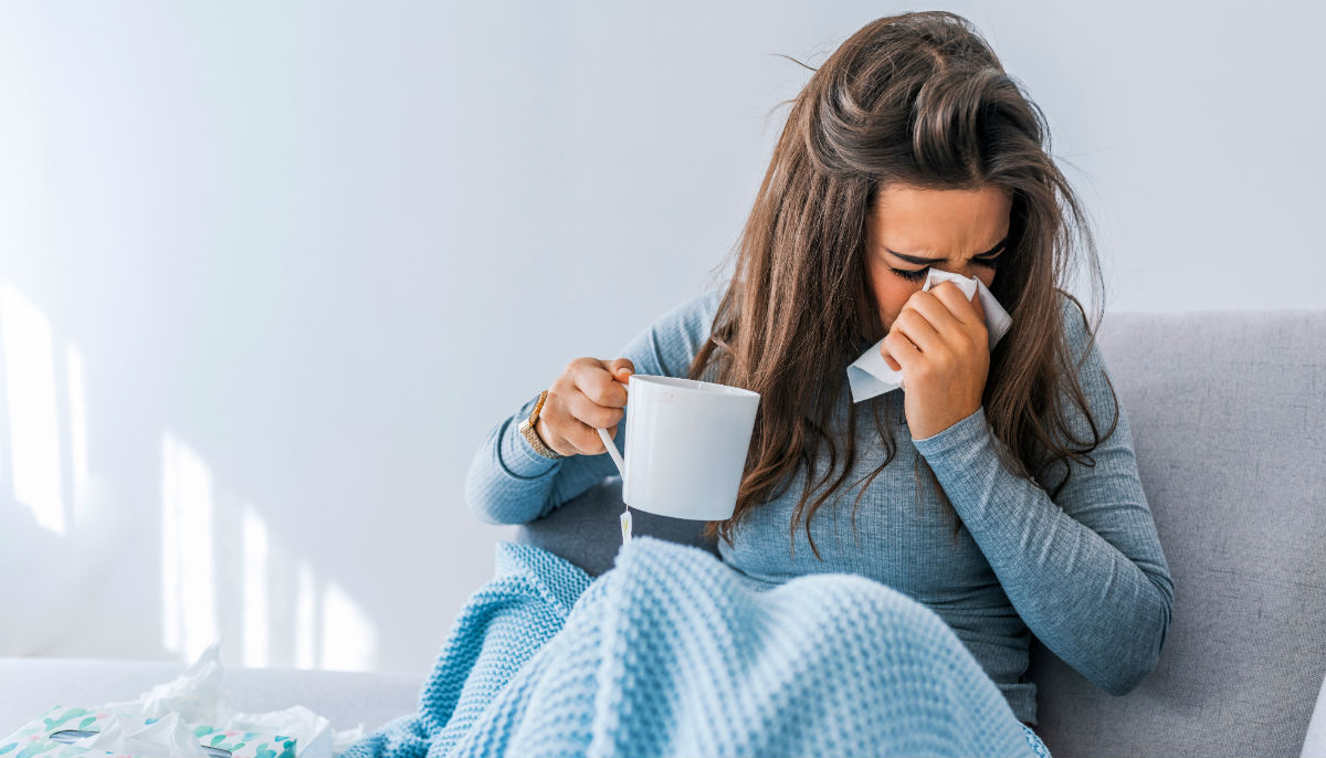 woman sneezing